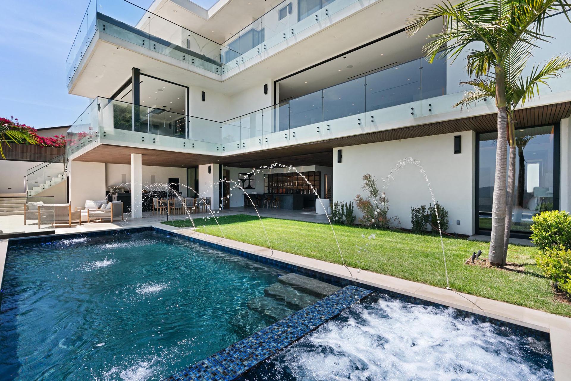 Villa with palm-lined pool